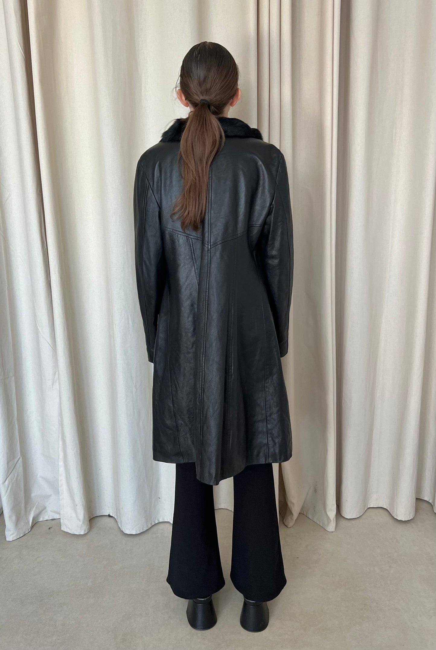 Genuine leather coat with fur trim