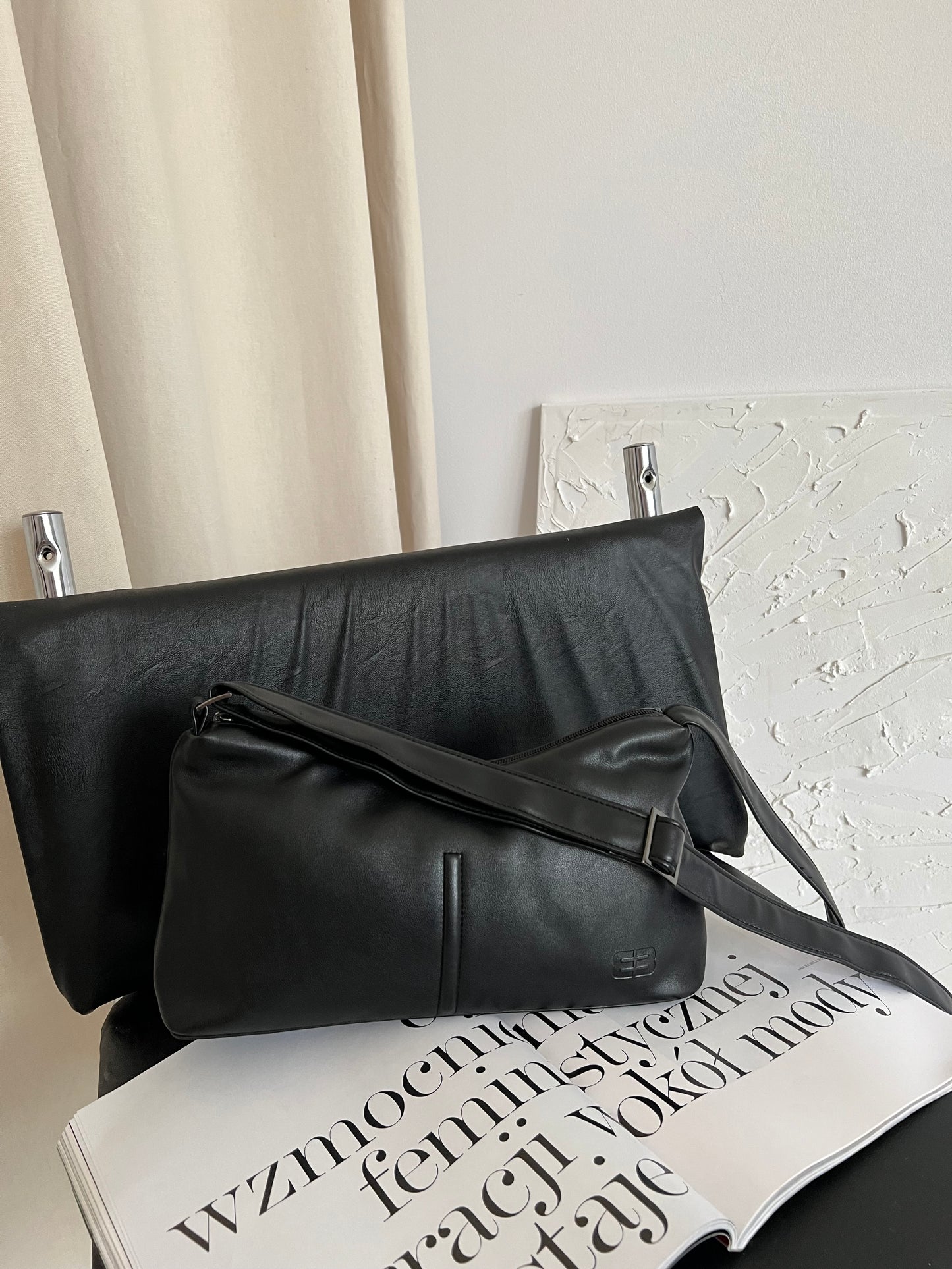 Black bag with a long strap