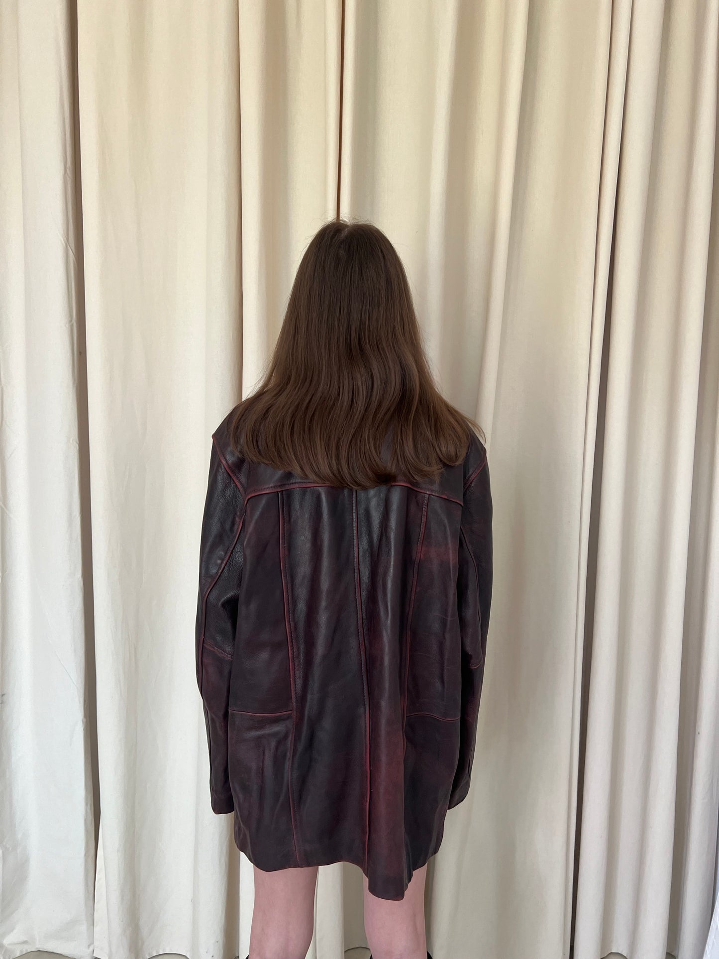 Genuine leather jacket with burgundy abrasions