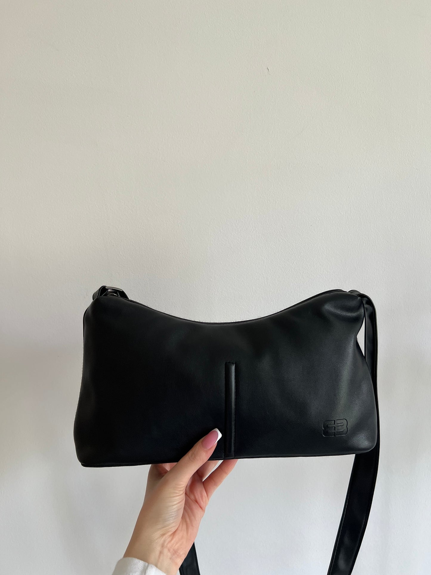Black bag with a long strap