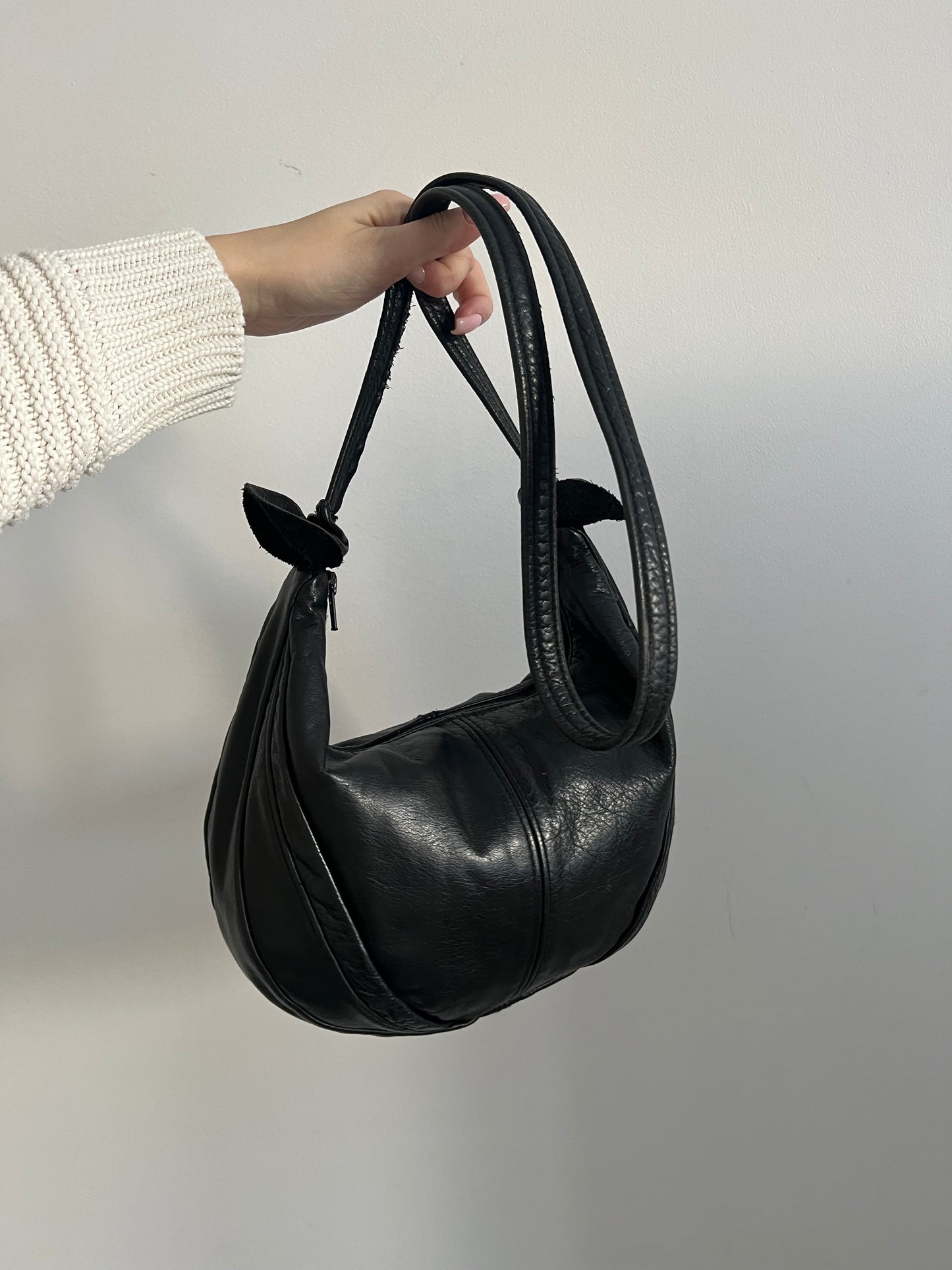 Bag with a long strap made of natural leather