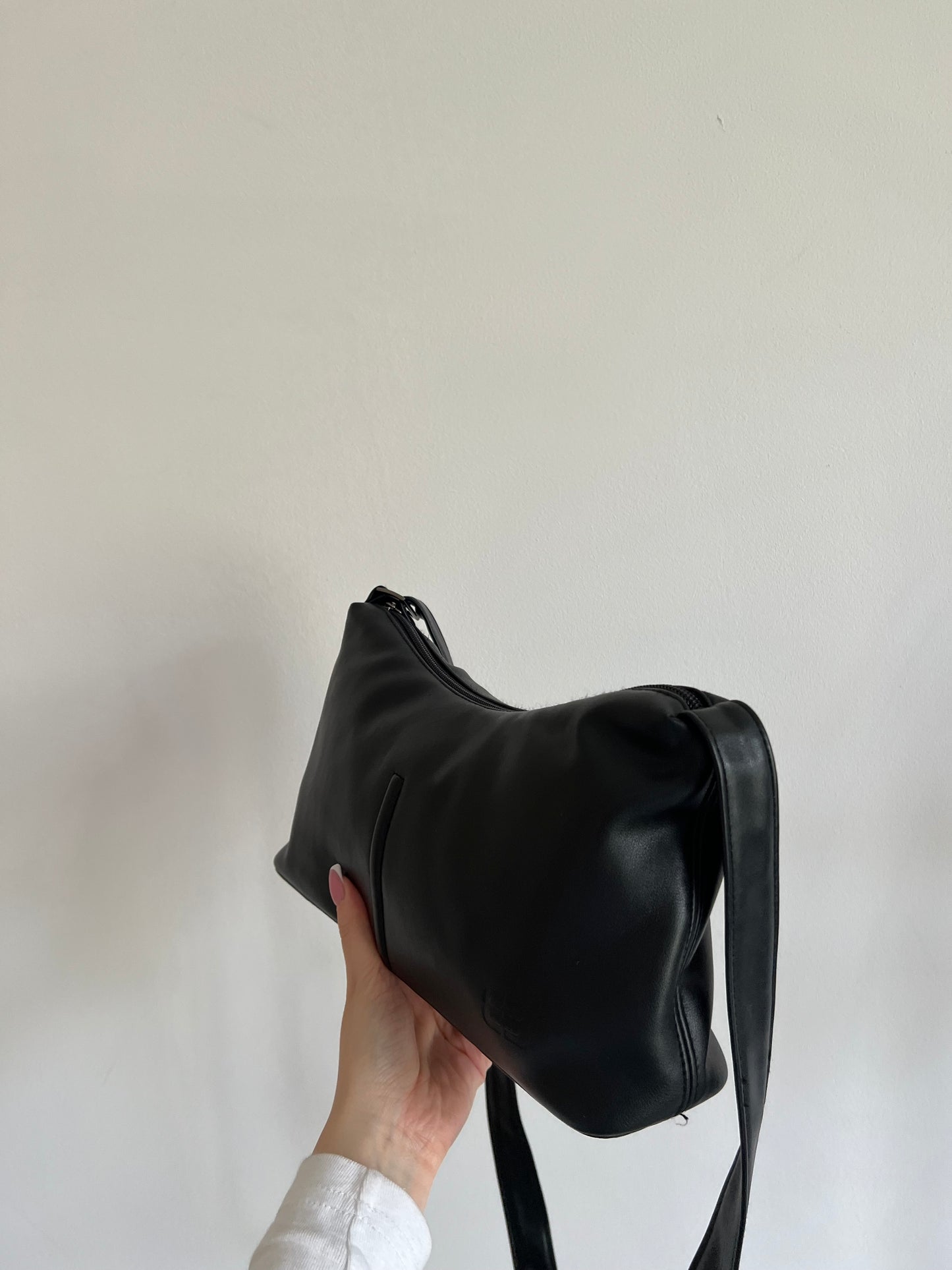 Black bag with a long strap